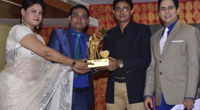 Yogesh Mishra (2nd from right) while recieving award